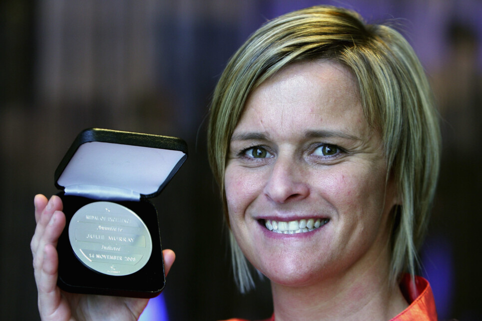 MELBOURNE, AUSTRALIA - NOVEMBER 14:  Julie Murray poses for photos with her Medal of Excellence at the Football Hall of Fame Induction Luncheon at Zinc Restaurant on November 14, 2008 in Melbourne, Australia.  (Photo by Mark Dadswell/Getty Images)
