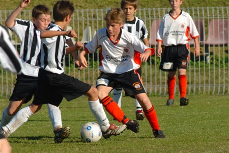a group of young men playing a game of football