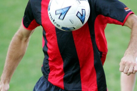 a person holding a football ball