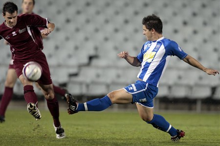 a group of men playing football on a field