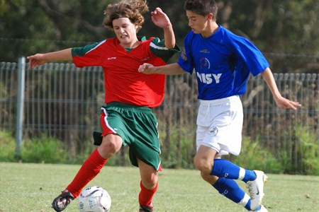 a group of young men playing a game of football