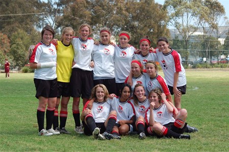 a group of football players posing for a picture