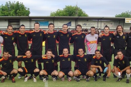 a group of football players posing for a photo