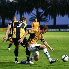 GOSFORD, AUSTRALIA - FEBRUARY 08:  Matthew Thompson of the Jets controls the ball in front of Shane Huke of the Mariners during the round 26 A-League match between the Central Coast Mariners and the Newcastle Jets at Bluetongue Stadium on February 8, 2010 in Gosford, Australia.  (Photo by Matt King/Getty Images) *** Local Caption *** Matthew Thompson;Shane Huke
