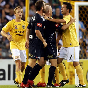 MELBOURNE, AUSTRALIA - NOVEMBER 07:  Players argue as a yellow card is issued by the referee during the round 14 A-League match between the Melbourne Victory and the Central Coast Mariners at Etihad Stadium on November 7, 2009 in Melbourne, Australia.  (Photo by Quinn Rooney/Getty Images)
