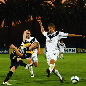 GOSFORD, AUSTRALIA - DECEMBER 12:  Matthew Simon of the Mariners shoots on goal during the round 18 A-League match between the Central Coast Mariners and the Melbourne Victory at Bluetongue Stadium on December 12, 2009 in Gosford, Australia.  (Photo by Ryan Pierse/Getty Images) *** Local Caption *** Matthew Simon