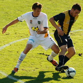 GOSFORD, AUSTRALIA - JANUARY 22:  Panagiotis Nikas of the Mariners is challenged by Benjamin Wearing of the Gold Coast during the round 21 National Youth League match between the Central Coast Mariners and the Gold Coast United at Bluetongue Stadium on January 22, 2010 in Gosford, Australia.  (Photo by Corey Davis/Getty Images) *** Local Caption *** Panagiotis Nikas;Benjamin Wearing