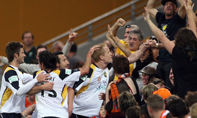 BRISBANE, AUSTRALIA - AUGUST 31:  Matt Simon of the Mariners celebrates with fans during the round three A-League match between the Queensland Roar and the Central Coast Mariners held at Suncorp Stadium on August 31, 2008 in Brisbane, Australia.  (Photo by Bradley Kanaris/Getty Images) *** Local Caption *** Matt Simon