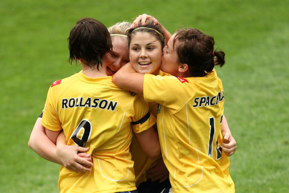 SYDNEY, AUSTRALIA - OCTOBER 05:  Michelle Heyman of the Mariners is kissed on the cheek by Samantha Spackman as they celebrate after scoring a goal during the round one W-League match between Sydney FC and the Central Coast Mariners at Sydney Football Stadium on October 5, 2009 in Sydney, Australia.  (Photo by Mark Kolbe/Getty Images)