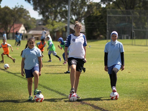 Students Amani Wehbe and Nataha Tlayje from the Villawood East PS will have a football clinic put on with Sydney FC and Matildas star Renee Rollason. Picture: Simon Bennett