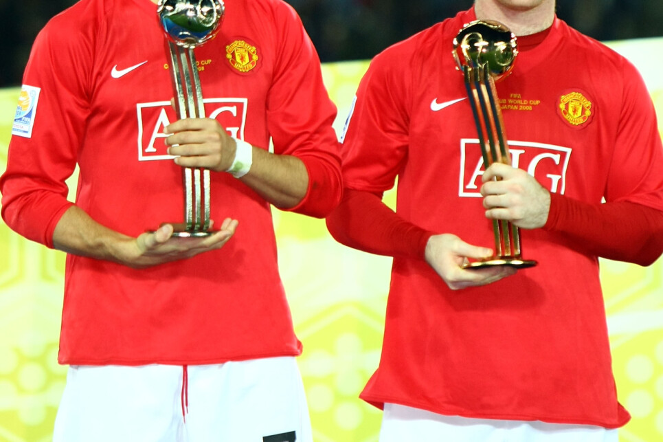 YOKOHAMA, JAPAN - DECEMBER 21:  Wayne Rooney and Cristiano Ronaldo of Manchester United receives Golden Ball and Silver Ball respectively during the award ceremony after the FIFA Club World Cup Japan 2008 final match between Manchester United and Liga de Quito at the International Stadium Yokohama on December 21, 2008 in Yokohama, Kanagawa, Japan. Manchester United won by 1-0.  (Photo by Koichi Kamoshida/Getty Images)