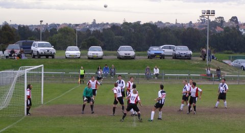 a group of people playing football on a field