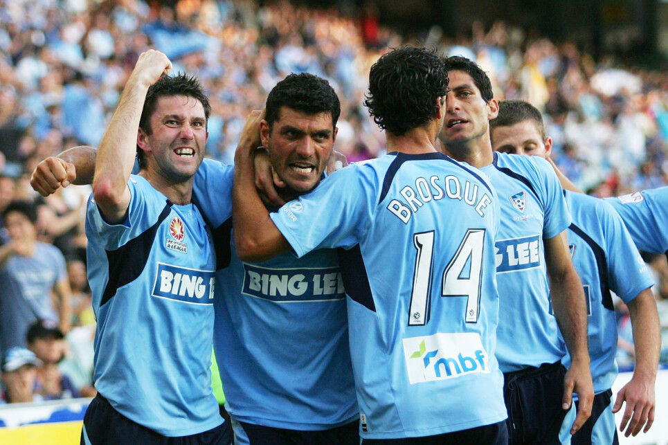 SYDNEY, AUSTRALIA - DECEMBER 05:  John Aloisi (C) of Sydney celebrates scoring a first half goal with Terry McFlynn (L) and Alex Brosque (R) during the round 17 A-League match between Sydney FC and the North Queensland Fury at Sydney Football Stadium on December 5, 2009 in Sydney, Australia.  (Photo by Matt King/Getty Images)
