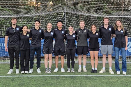 a group of people posing for a photo