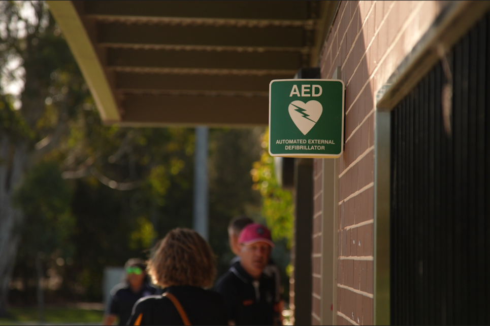 AED Image a person standing in front of a sign