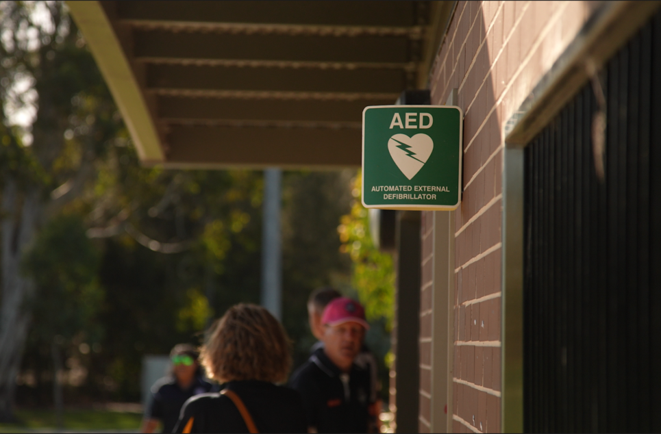 a person standing in front of a sign
