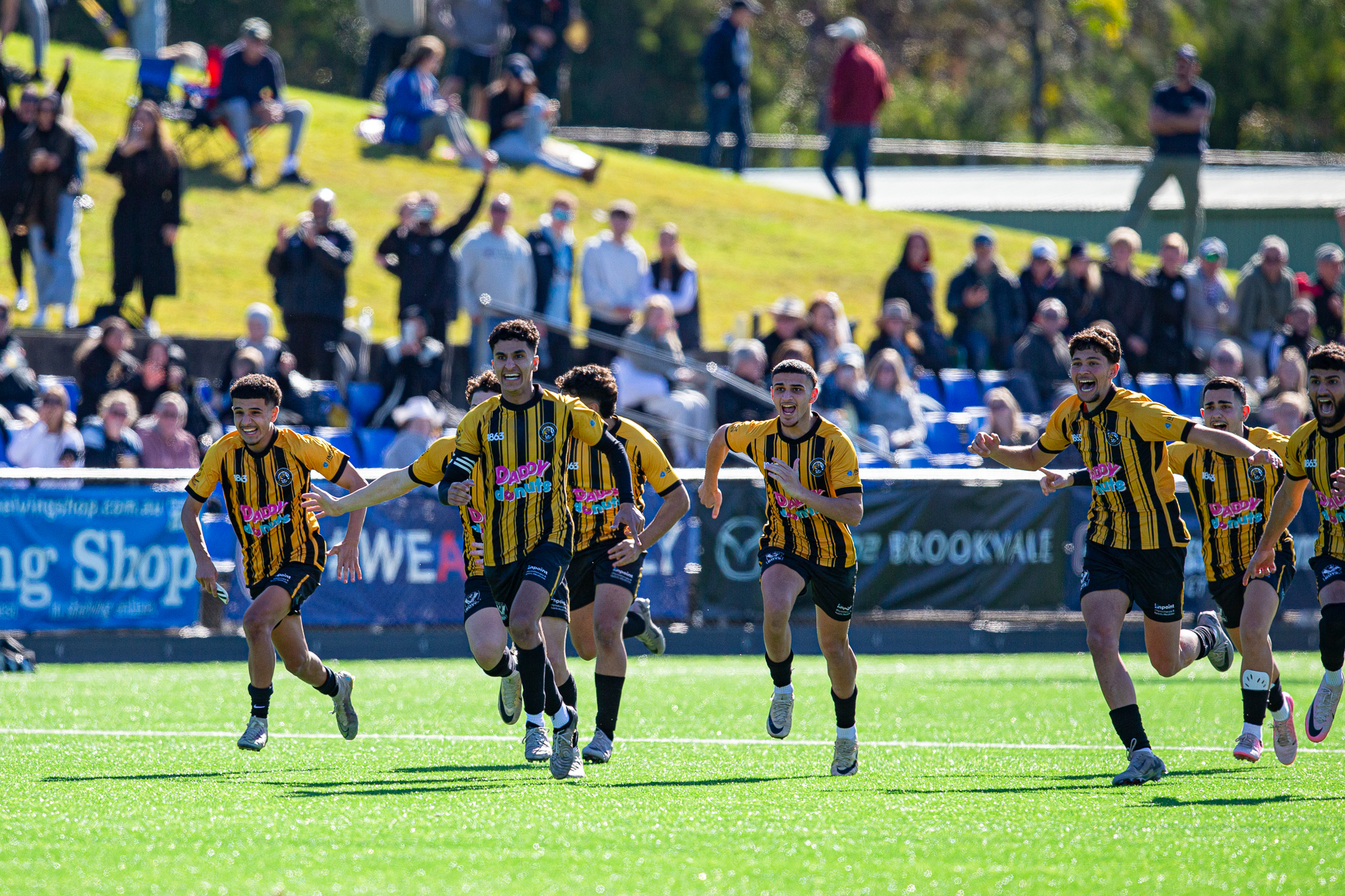 a group of people watching a football game