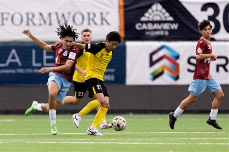 a group of people playing football on a field