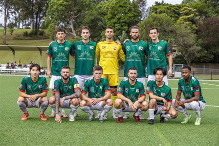 a group of football players posing for a picture