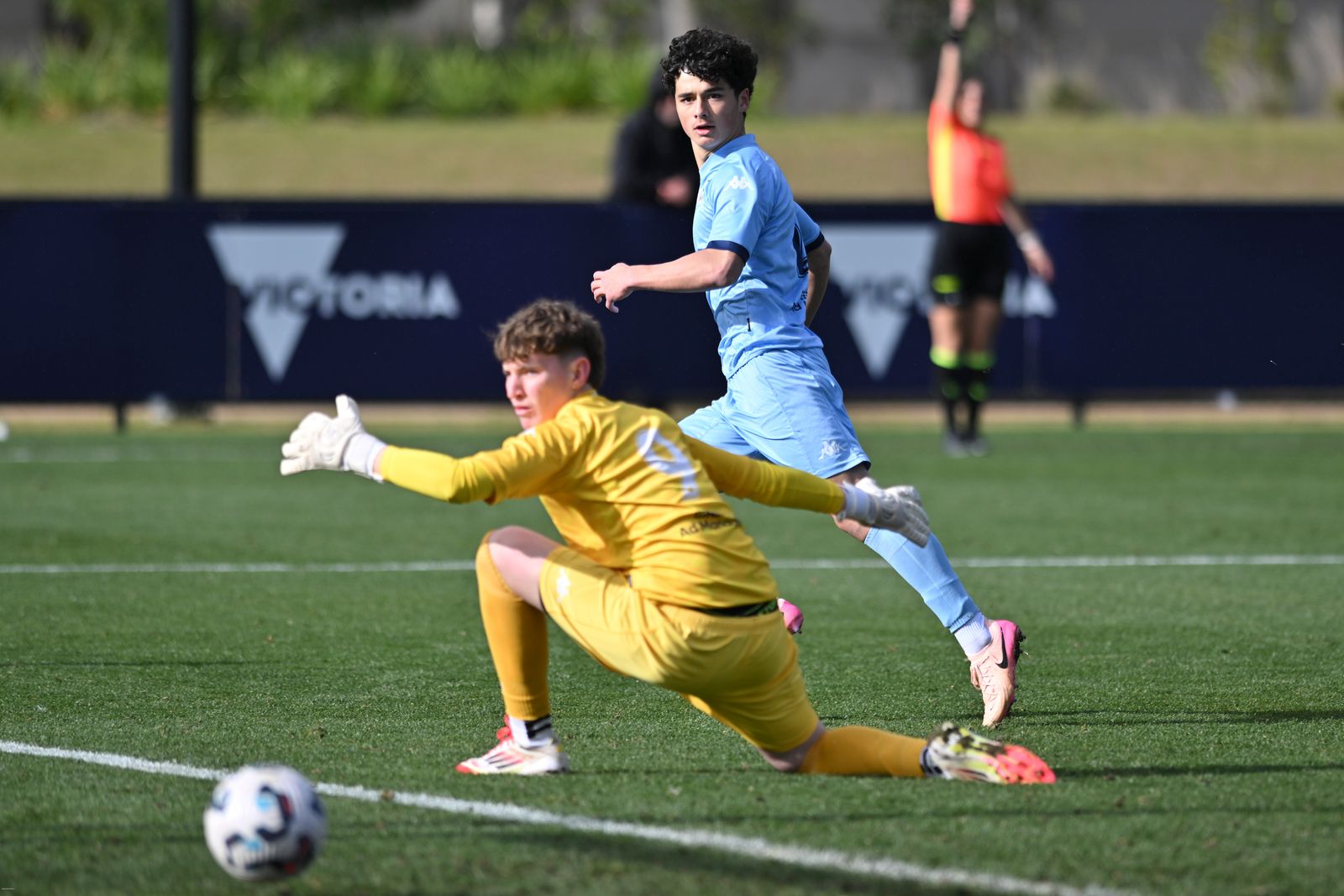 a girl playing football on a field