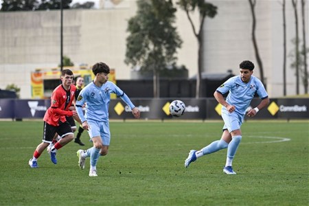 a group of people playing football on a field