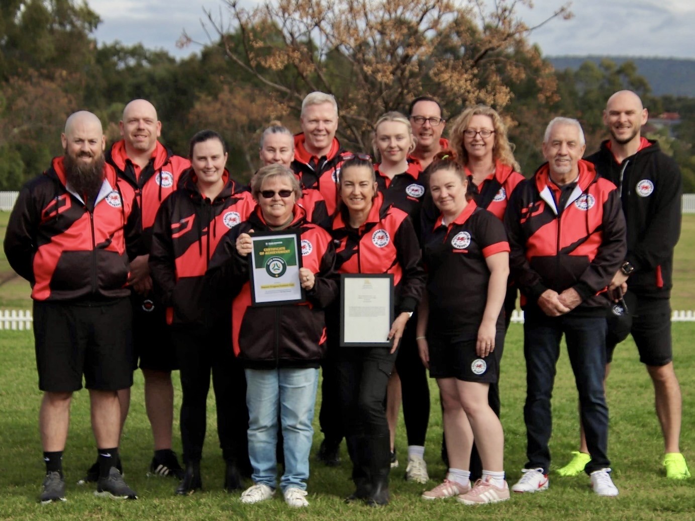 a group of people posing for a photo