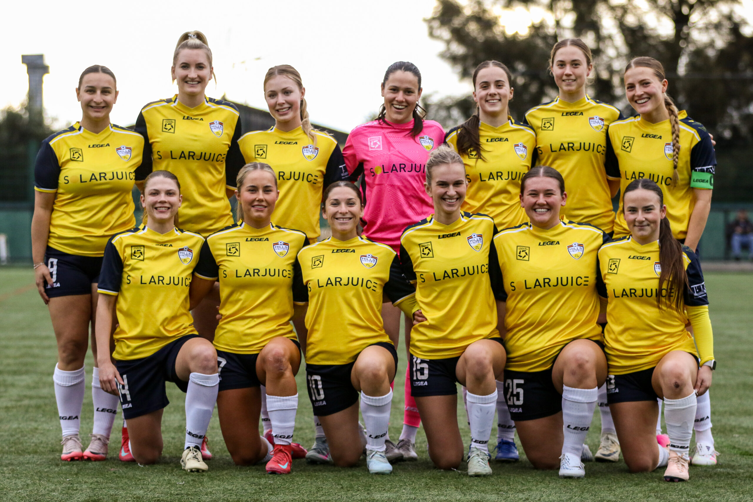 a group of football players posing for a picture