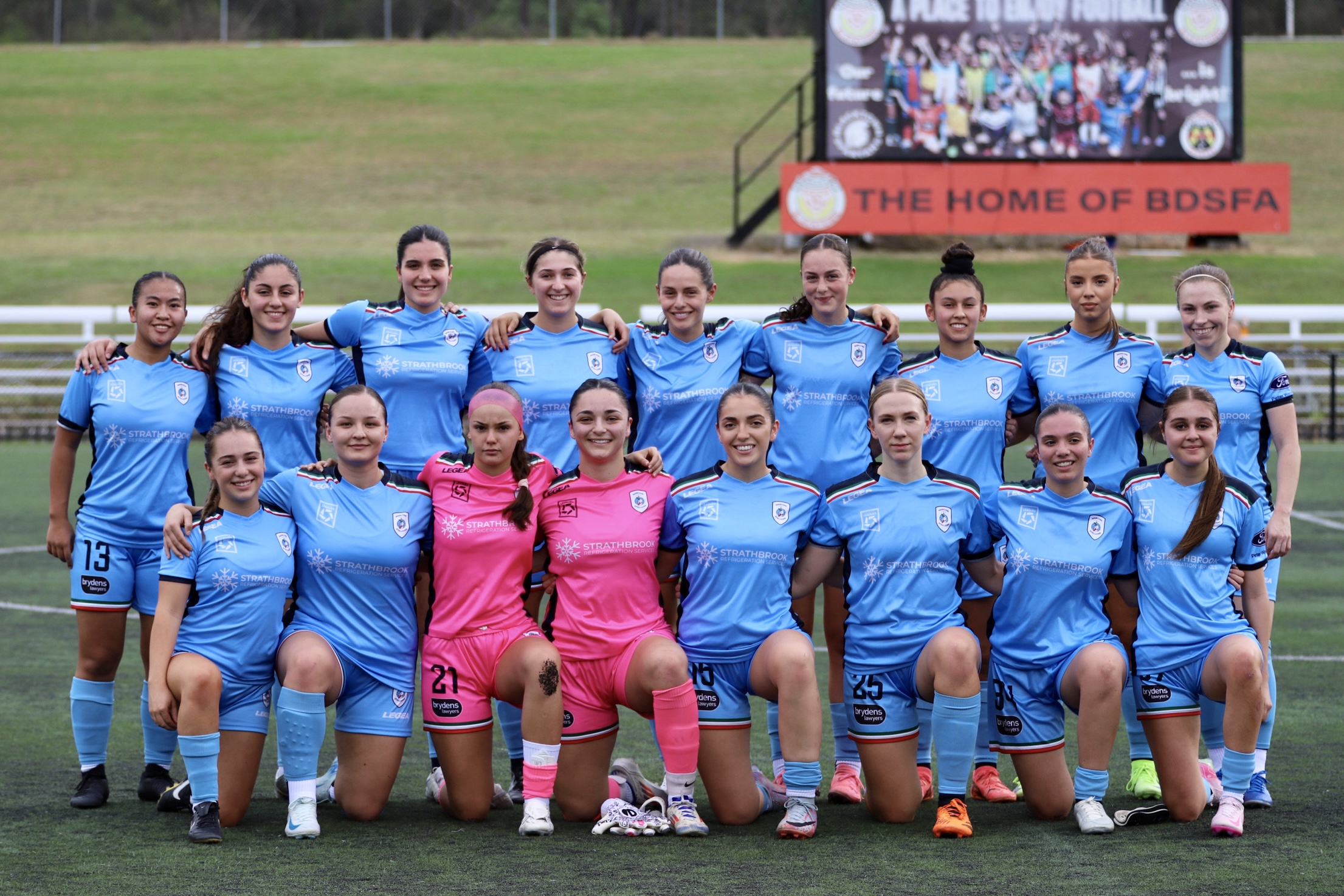 a group of football players posing for a picture