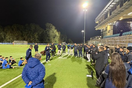 a group of people standing in front of a crowd