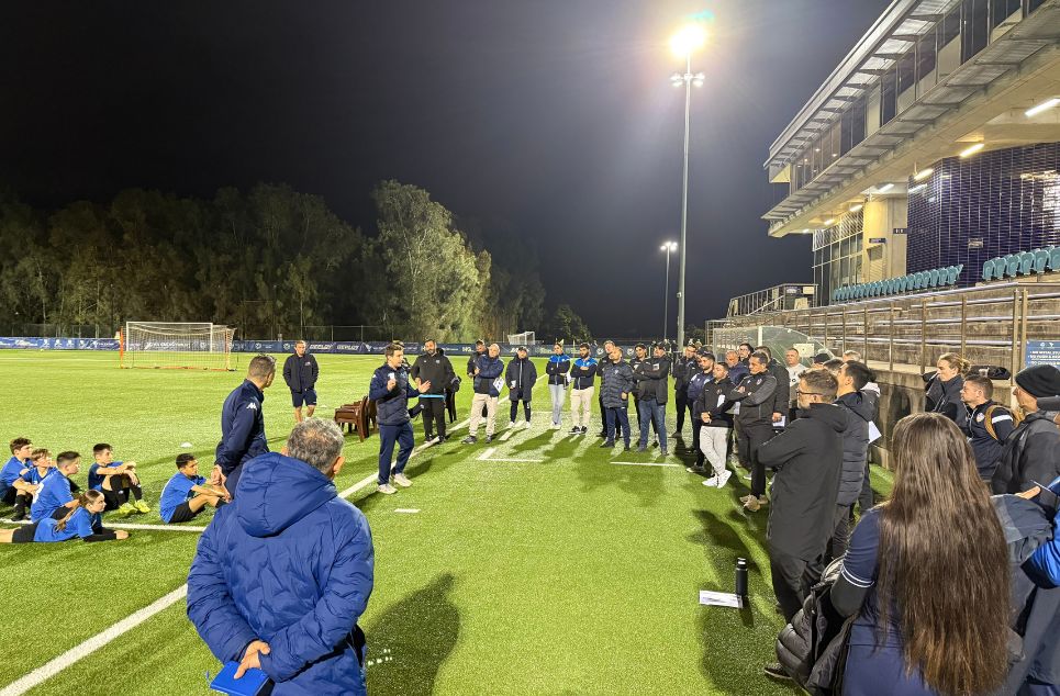 a group of people standing in front of a crowd