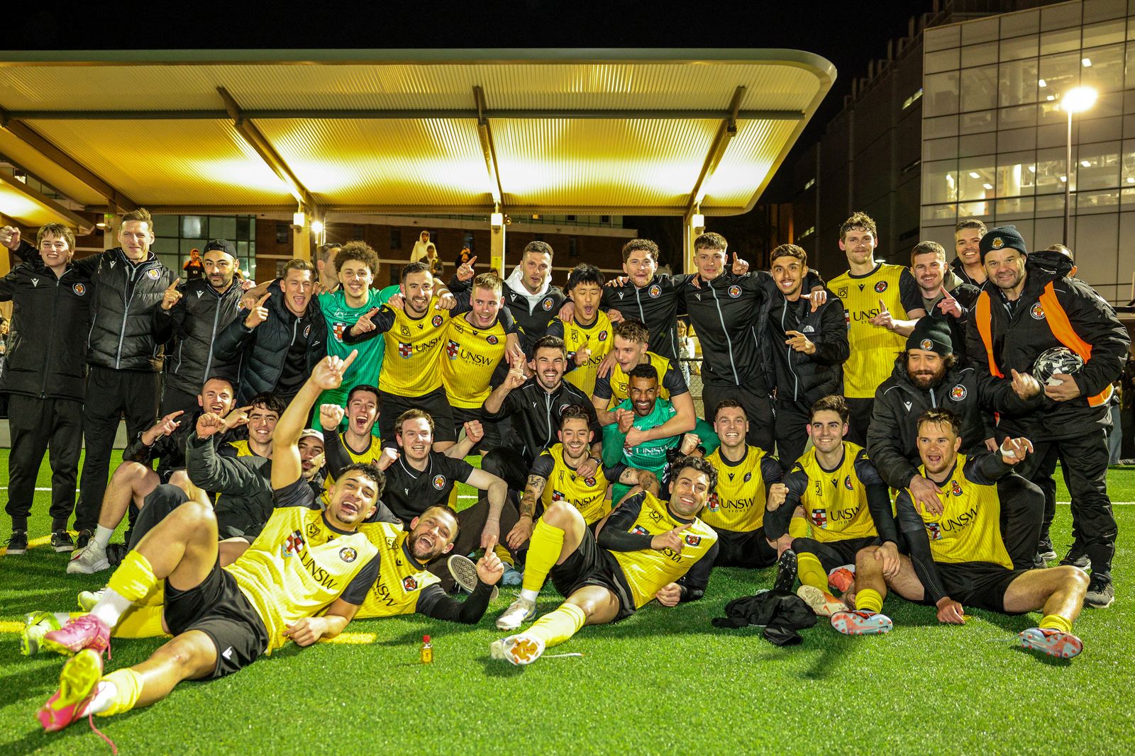 a group of people watching a football ball