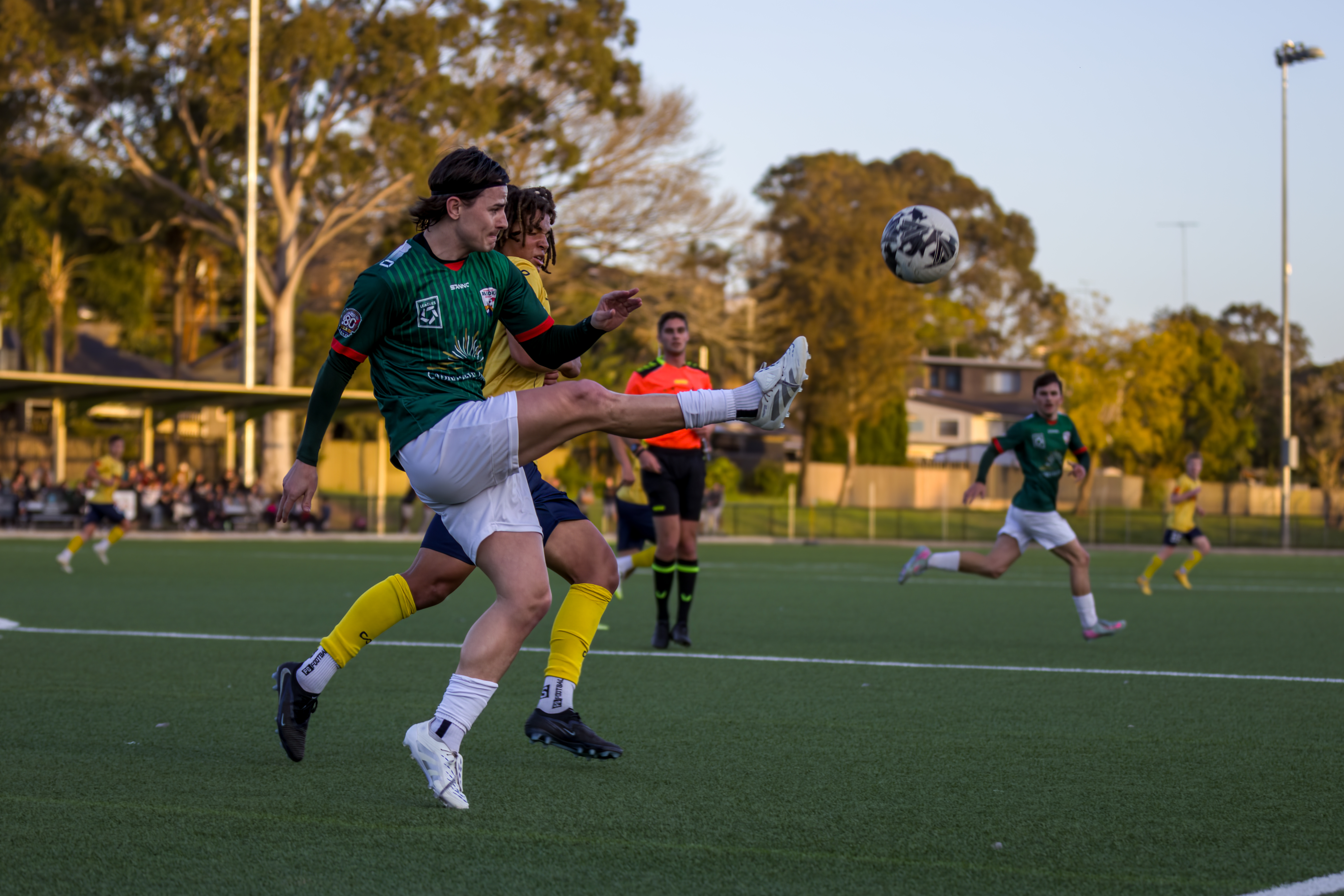 a group of young men playing a game of football
