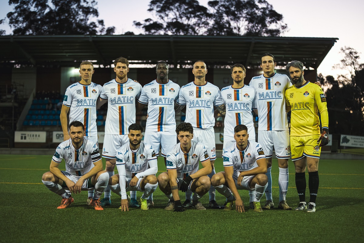 a group of football players posing for a picture