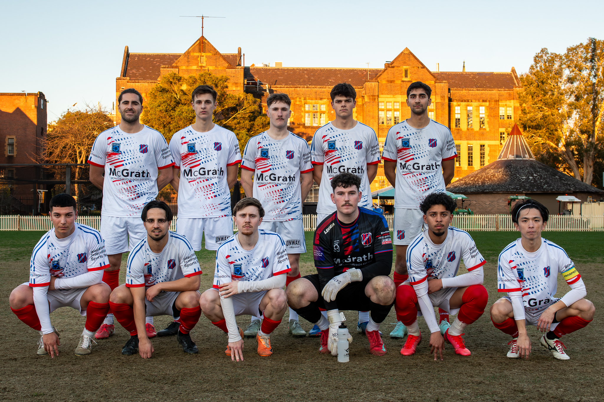 a group of football players posing for a picture