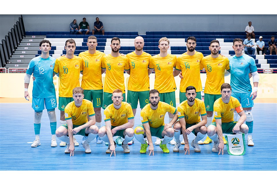 a group of football players posing for a picture