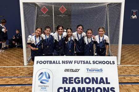 a group of people standing in front of a sign