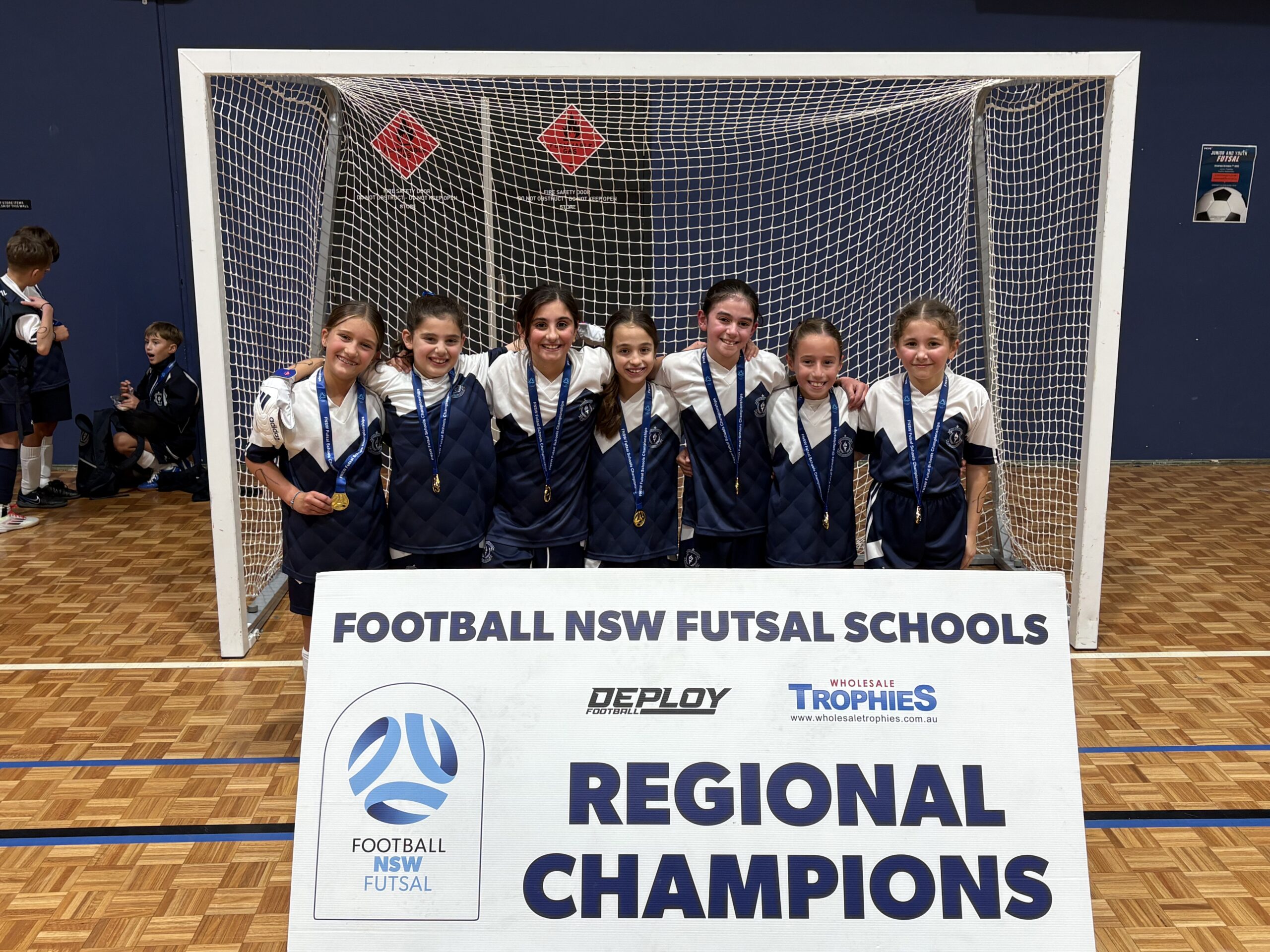 a group of people standing in front of a sign