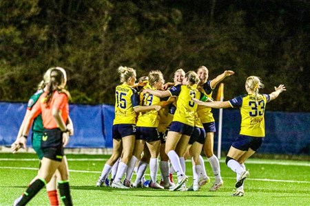 a group of young men playing a game of football