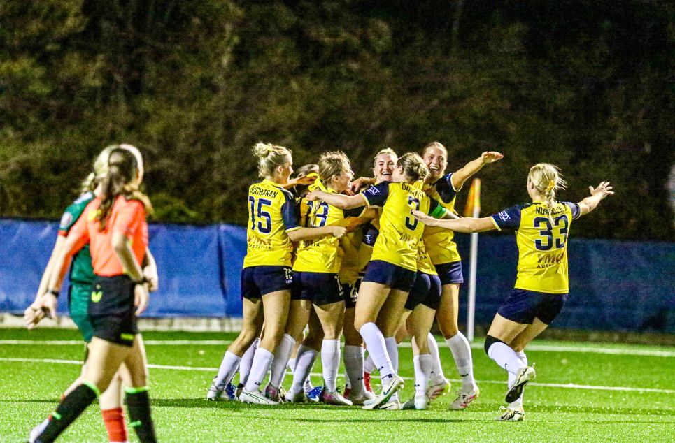 a group of young men playing a game of football