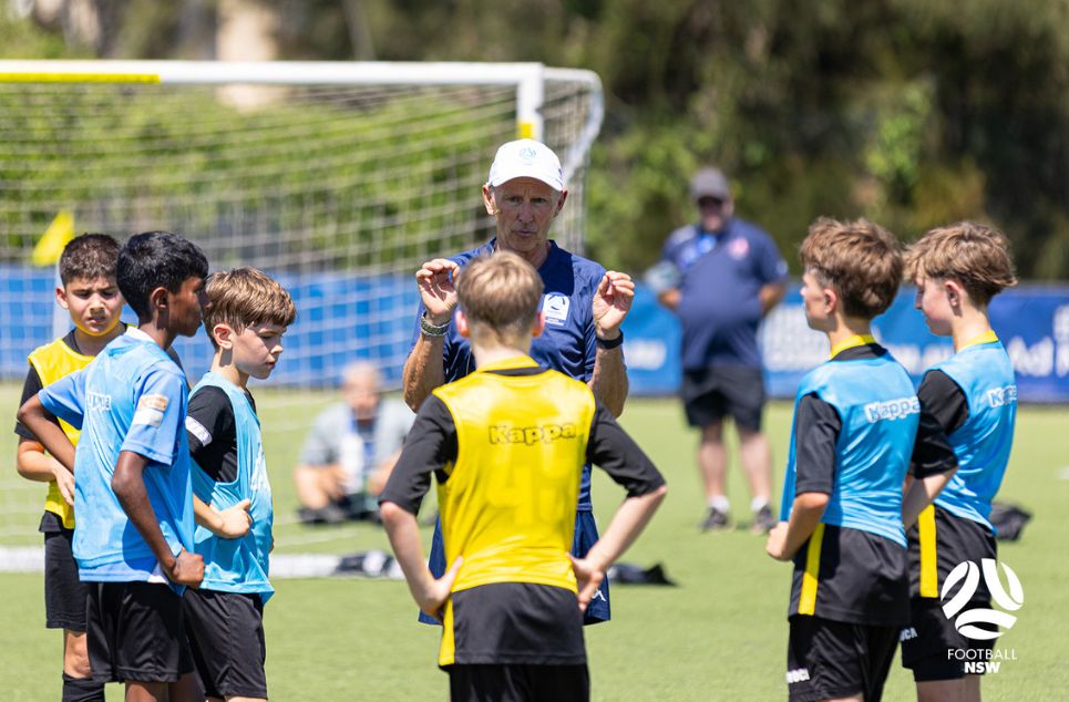 a group of young men playing a game of football