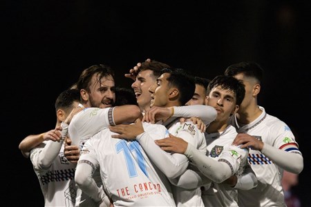 a group of people around each other