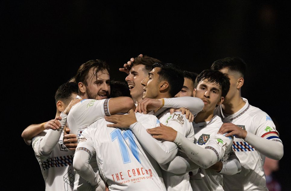 a group of people around each other