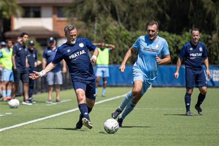 a group of young men playing a game of football