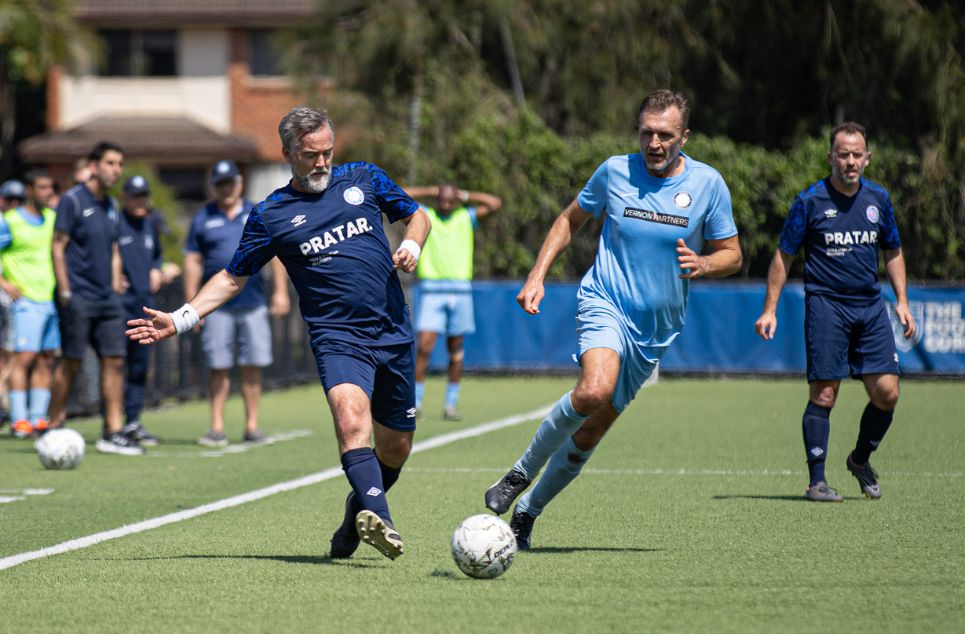 a group of young men playing a game of football