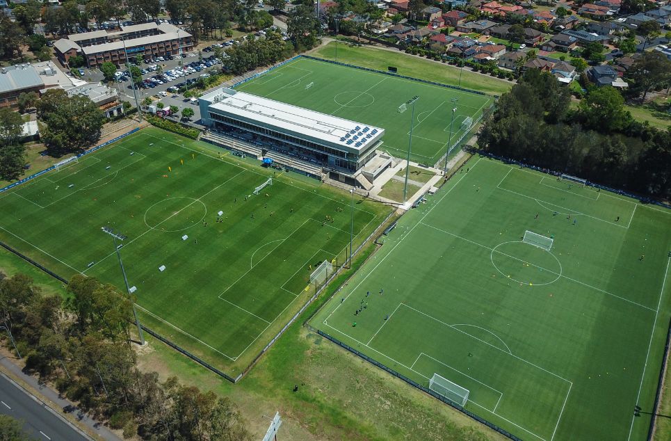 a large stadium with green grass