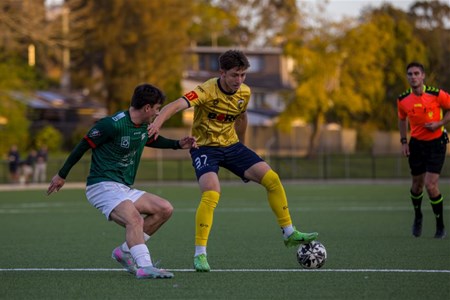 a group of young men playing a game of football