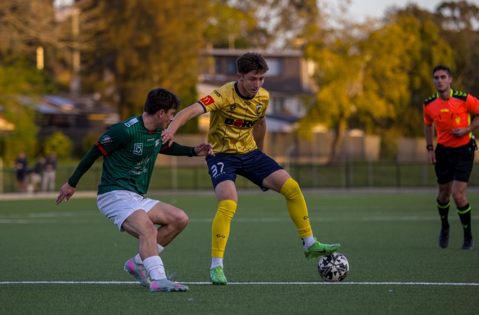 a group of young men playing a game of football