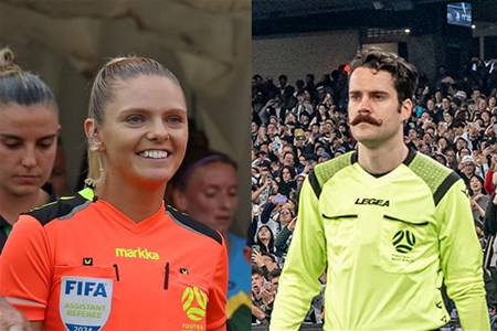 a group of people standing in front of a crowd posing for the camera