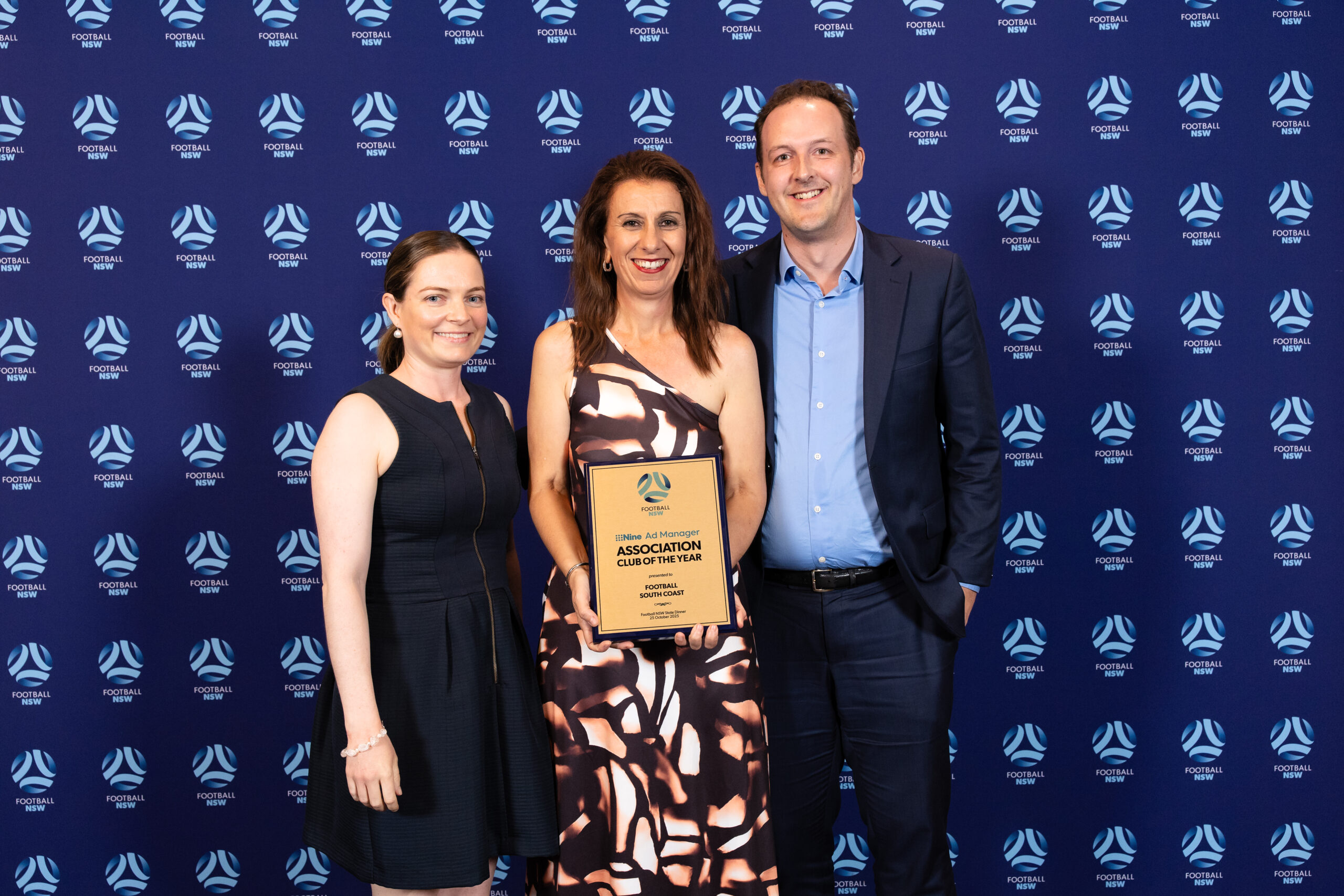 a group of people posing for a photo