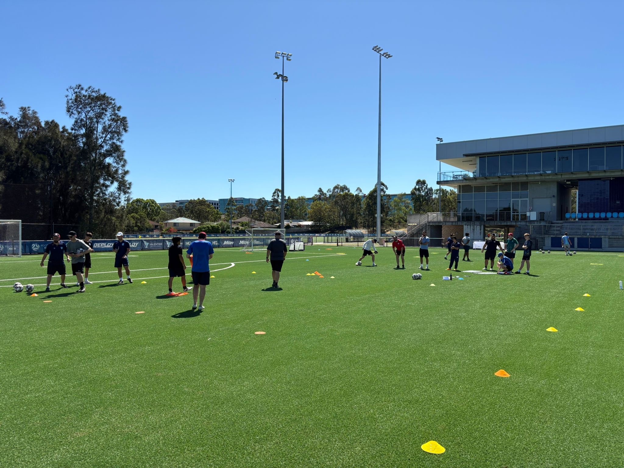 a group of people playing football on a field